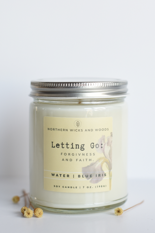 Candle jar with a label on a white background